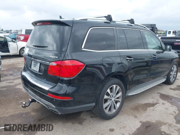 2014 Mercedes-Benz GL 450 with VIN 4JGDF7CE0EA372225, listed as a IAAI auction lot 42141012 with 158,045 mi miles and . Bid and sale history available at DreamBid. Image 4.