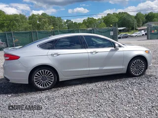 2017 Ford Fusion Titanium with VIN 3FA6P0K99HR112234, listed as a IAAI auction lot 42332700 with 106,685 mi miles and . Bid and sale history available at DreamBid. Image 13.
