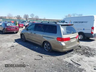 2010 Honda Odyssey Touring with VIN 5FNRL3H9XAB094765, listed as a IAAI auction lot 41892743 with 127,143 mi miles. Bid and sale history available at carsss.com. Image 3.