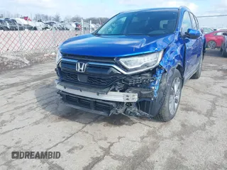 2020 Honda CR-V Touring with VIN 7FARW2H91LE012284, listed as a IAAI auction lot 41672460 with 28,207 mi miles and . Bid and sale history available at DreamBid. Image 6.
