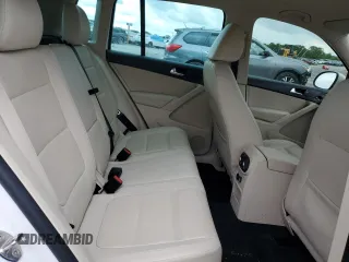 2014 Volkswagen Tiguan SE z VIN WVGAV3AX5EW551477, wystawiony jako Copart lot #55773245 z przebiegiem 153 437 mil mil oraz Czysty tytuł • Clean title. Historia ofert i sprzedaży dostępna na DreamBid. Obrazek 11.