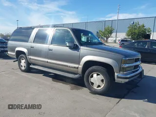 1999 Chevrolet Suburban z VIN 1GNFK16R1XJ409961, wystawiony jako IAAI lot #42021959 z przebiegiem 179 083 mil mil oraz . Historia ofert i sprzedaży dostępna na DreamBid. Obrazek 1.