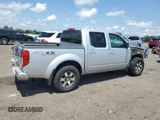 2010 Nissan Frontier Pro-4X with VIN 1N6AD0EV5AC435641, listed as a Copart auction lot 63388025 with 84,349 mi miles and Salvage title. Bid and sale history available at DreamBid. Image 3.