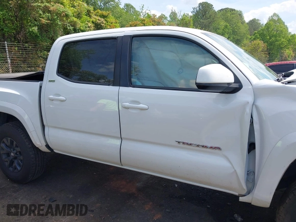 2021 Toyota Tacoma SR z VIN 5TFCZ5AN5MX265181, wystawiony jako IAAI lot #42077902 z przebiegiem 102 192 mil mil oraz . Historia ofert i sprzedaży dostępna na DreamBid. Obrazek 13.