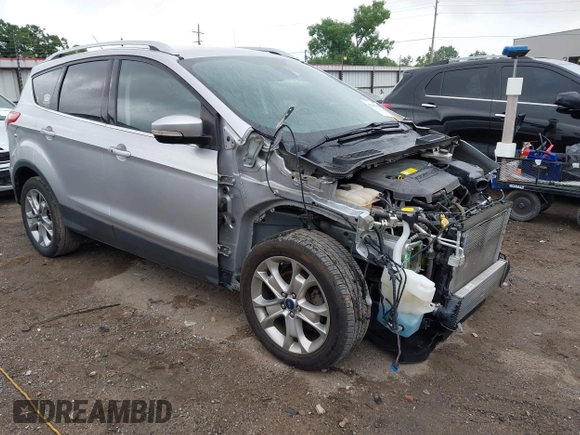 2015 Ford Escape Titanium with VIN 1FMCU0JX7FUB60418, listed as a IAAI auction lot 42485107 with 82,172 mi miles and . Bid and sale history available at DreamBid. Image 1.