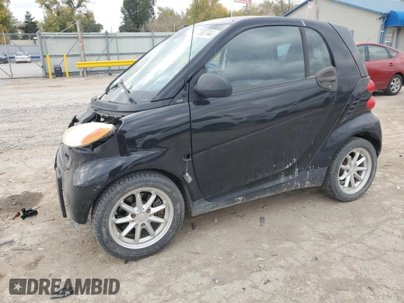 2009 Smart fortwo Pure with VIN WMEEJ31X19K267800, listed as a Copart auction lot 77392744 with 100,178 mi miles and Salvage Title. Bid and sale history available at carsss.com. Image 1.