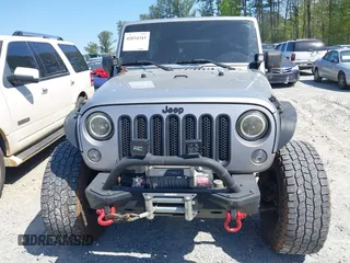 2014 Jeep Wrangler Unlimited Sport with VIN 1C4BJWDG4EL292421, listed as a IAAI auction lot 42034343 with 157,820 mi miles. Bid and sale history available at carsss.com. Image 12.