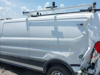 2024 Ford Transit Cargo with VIN 1FTBR1Y89RKA77093, listed as a IAAI auction lot 42556386 with 3,290 mi miles and . Bid and sale history available at DreamBid. Image 14.