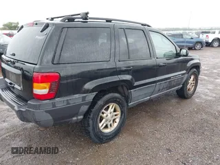 2004 Jeep Grand Cherokee Laredo with VIN 1J4GW48S74C390569, listed as a IAAI auction lot 42384503 with 191,530 mi miles and . Bid and sale history available at DreamBid. Image 4.