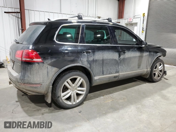 2011 Volkswagen Touareg Exec with VIN WVGFK9BP6BD006430, listed as a Copart auction lot 84288014 with 186,189 mi miles and Salvage Title. Bid and sale history available at DreamBid. Image 3.