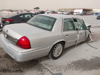 2010 Mercury Grand Marquis LS with VIN 2MEBM7FV5AX633703, listed as a IAAI auction lot 41728720 with 1 mi miles. Bid and sale history available at carsss.com. Image 4.