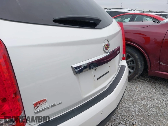 2012 Cadillac SRX Premium Collection z VIN 3GYFNFE38CS591123, wystawiony jako IAAI lot #41827636 z przebiegiem 143 867 mil mil oraz . Historia ofert i sprzedaży dostępna na DreamBid. Obrazek 21.