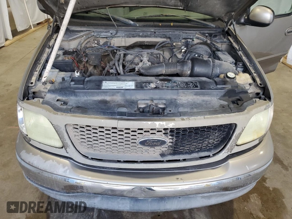 2003 Ford F-150 XL with VIN 1FTRX17283NA46215, listed as a Copart auction lot 85194094 with 168,415 mi miles and Salvage title. Bid and sale history available at DreamBid. Image 13.