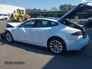 2016 Tesla Model S 90D with VIN 5YJSA1E26GF147327, listed as a IAAI auction lot 42077766 with 89,502 mi miles and . Bid and sale history available at DreamBid. Image 3.