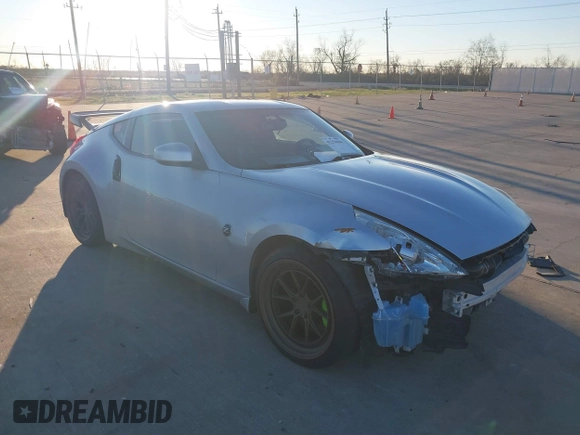 2014 Nissan 370Z Nismo with VIN JN1AZ4EH4EM634236, listed as a IAAI auction lot 41256664 with 80,294 mi miles and . Bid and sale history available at DreamBid. Image 1.