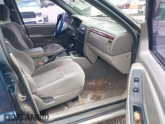 2000 Jeep Grand Cherokee Laredo z VIN 1J4GW48S9YC338947, wystawiony jako IAAI lot #42545830 z przebiegiem 234 251 mil mil oraz . Historia ofert i sprzedaży dostępna na DreamBid. Obrazek 5.