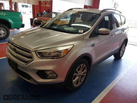 2018 Ford Escape SE z VIN 1FMCU9GD3JUC13075, wystawiony jako IAAI lot #42537659 z przebiegiem 77 270 mil mil oraz . Historia ofert i sprzedaży dostępna na DreamBid. Obrazek 13.