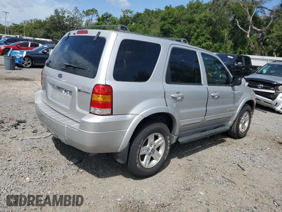 2006 Ford Escape Hybrid z VIN 1FMCU96H36KA35403, wystawiony jako Copart lot #65374705 z przebiegiem 127 689 mil mil oraz Czysty tytuł • Clean title. Historia ofert i sprzedaży dostępna na DreamBid. Obrazek 3.