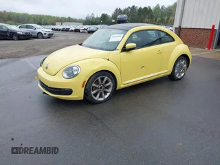 2012 Volkswagen Beetle 2.5L w/Sound/Nav PZEV with VIN 3VWJP7AT4CM613867, listed as a IAAI auction lot 41602806 with 167,004 mi miles. Bid and sale history available at carsss.com. Image 2.