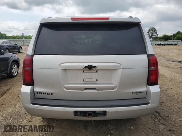 2016 Chevrolet Tahoe LS with VIN 1GNSCAKC7GR292272, listed as a Copart auction lot 54091975 with 221,137 mi miles and Salvage title. Bid and sale history available at DreamBid. Image 6.