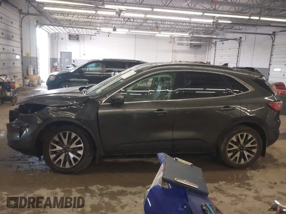 2020 Ford Escape Titanium with VIN 1FMCU9J95LUA39338, listed as a IAAI auction lot 42319122 with 34,631 mi miles and . Bid and sale history available at DreamBid. Image 15.