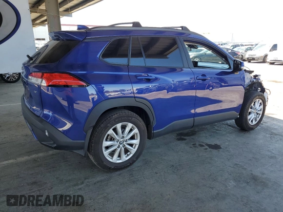 2022 Toyota Corolla Cross LE with VIN 7MUCAAAG6NV021103, listed as a Copart auction lot 56882015 with 21,769 mi miles and Salvage title. Bid and sale history available at DreamBid. Image 3.