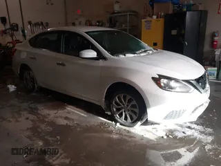 2019 Nissan Sentra S z VIN 3N1AB7AP9KY325065, wystawiony jako IAAI lot #41612204 z przebiegiem 141 818 mil mil oraz . Historia ofert i sprzedaży dostępna na DreamBid. Obrazek 1.