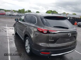 2016 Mazda CX-9 Grand Touring z VIN JM3TCADY6G0126391, wystawiony jako IAAI lot #42242541 z przebiegiem 45 147 mil mil oraz . Historia ofert i sprzedaży dostępna na DreamBid. Obrazek 3.