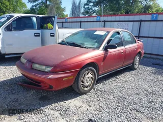 1998 Saturn SL z VIN 1G8ZK5270WZ223002, wystawiony jako IAAI lot #41959507 z przebiegiem Nie podano mil oraz . Historia ofert i sprzedaży dostępna na DreamBid. Obrazek 2.