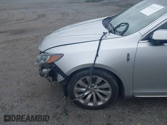 2013 Lincoln MKS с VIN 1LNHL9DK3DG604712, выставлен на аукционе IAAI как лот 42351237 с пробегом 144 927 миль миль и . История ставок и продаж доступна на DreamBid. Изображение 16.