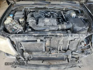 2009 Nissan Frontier LE with VIN 1N6AD09U79C409698, listed as a Copart auction lot 55843545 with 230,334 mi miles and Salvage title. Bid and sale history available at DreamBid. Image 11.