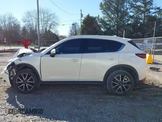 2018 Mazda CX-5 Grand Touring with VIN JM3KFADM0J0377026, listed as a IAAI auction lot 41649686 with 100,901 mi miles and . Bid and sale history available at DreamBid. Image 14.