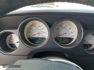 2012 Dodge Challenger SXT Plus with VIN 2C3CDYAG7CH128168, listed as a Copart auction lot 47273945 with 196,025 mi miles and Salvage Title. Bid and sale history available at carsss.com. Image 9.
