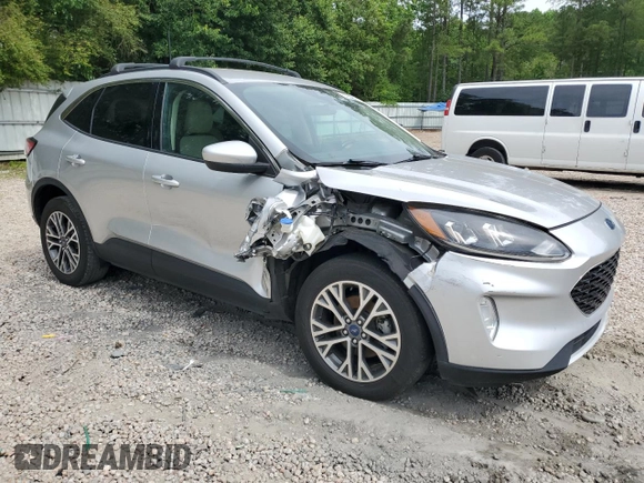 2020 Ford Escape SEL z VIN 1FMCU9H66LUB44403, wystawiony jako Copart lot #57934925 z przebiegiem Nie podano mil oraz Szkoda całkowita • Salvage title. Historia ofert i sprzedaży dostępna na DreamBid. Obrazek 4.