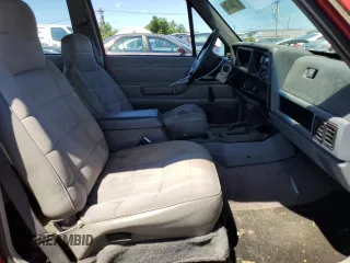 1995 Jeep Cherokee Sport with VIN 1J4FJ67S6SL549912, listed as a Copart auction lot 61104474 with 296,507 mi miles and Clean Title. Bid and sale history available at carsss.com. Image 7.