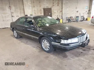 1997 Cadillac Seville Luxury SLS with VIN 1G6KS52YXVU816736, listed as a IAAI auction lot 41854220 with 107,091 mi miles. Bid and sale history available at carsss.com. Image 1.