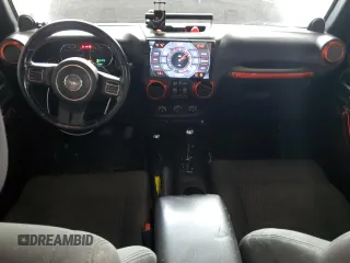 2012 Jeep Wrangler Unlimited Sahara with VIN 1C4BJWEG3CL195271, listed as a Copart auction lot 59947235 with 212,819 mi miles and Salvage title. Bid and sale history available at DreamBid. Image 8.