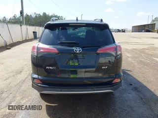 2018 Toyota RAV4 XLE with VIN 2T3WFREVXJW444002, listed as a IAAI auction lot 41795600 with 115,120 mi miles. Bid and sale history available at carsss.com. Image 16.