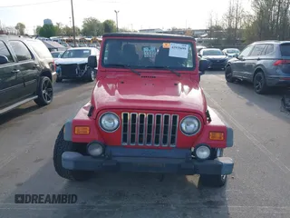 2003 Jeep Wrangler Sport with VIN 1J4FA49S13P320159, listed as a IAAI auction lot 41935699 with 212,355 mi miles. Bid and sale history available at carsss.com. Image 12.