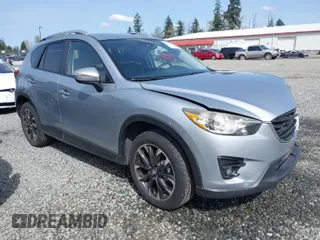 2016 Mazda CX-5 Grand Touring with VIN JM3KE4DYXG0647802, listed as a IAAI auction lot 41996854 with 85,774 mi miles. Bid and sale history available at carsss.com. Image 1.