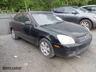 2008 Kia Optima LX with VIN KNAGE123885235142, listed as a IAAI auction lot 42112119 with 145,410 mi miles. Bid and sale history available at carsss.com. Image 1.