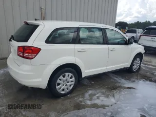 2014 Dodge Journey American Value with VIN 3C4PDCAB3ET216889, listed as a Copart auction lot 60874265 with 117,508 mi miles and Salvage title. Bid and sale history available at DreamBid. Image 3.