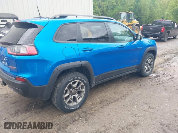 2021 Jeep Cherokee Trailhawk with VIN 1C4PJMBXXMD173102, listed as a IAAI auction lot 42205402 with 57,321 mi miles and . Bid and sale history available at DreamBid. Image 4.