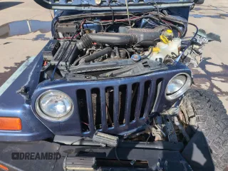 1997 Jeep Wrangler SE z VIN 1J4FY29P1VP441353, wystawiony jako Copart lot #51691545 z przebiegiem Nie podano mil oraz Szkoda całkowita • Salvage title. Historia ofert i sprzedaży dostępna na DreamBid. Obrazek 11.