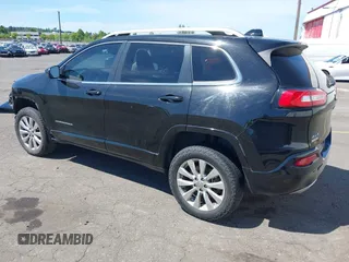 2017 Jeep Cherokee Overland z VIN 1C4PJMJS1HW530604, wystawiony jako IAAI lot #41701168 z przebiegiem 112 945 mil mil oraz . Historia ofert i sprzedaży dostępna na DreamBid. Obrazek 3.