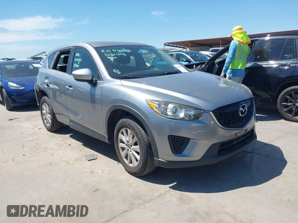 2014 Mazda CX-5 Sport with VIN JM3KE2BE7E0371203, listed as a IAAI auction lot 42243756 with 121,534 mi miles and . Bid and sale history available at DreamBid. Image 1.