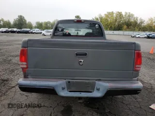 2003 Dodge Dakota Sport with VIN 1D7HL38N63S192308, listed as a Copart auction lot 77494684 with 128,512 mi miles and Salvage Title. Bid and sale history available at carsss.com. Image 6.