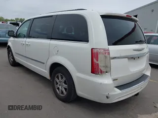 2013 Chrysler Town & Country Touring with VIN 2C4RC1BG4DR648838, listed as a IAAI auction lot 42004977 with 218,814 mi miles. Bid and sale history available at carsss.com. Image 3.