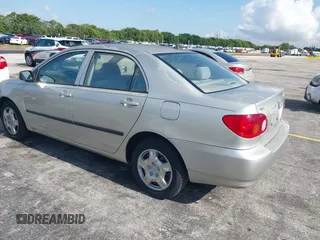 2003 Toyota Corolla CE with VIN JTDBR32E130010551, listed as a IAAI auction lot 42204515 with 129,759 mi miles. Bid and sale history available at carsss.com. Image 3.