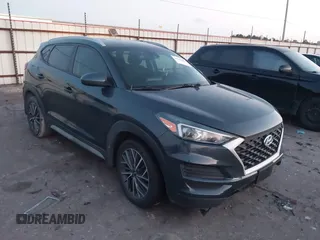 2019 Hyundai Tucson Sport with VIN KM8J33AL7KU901296, listed as a IAAI auction lot 41132884 with 76,948 mi miles. Bid and sale history available at carsss.com. Image 1.